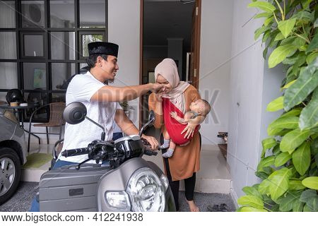 Muslim Man Going By Motorcycle Scooter Leaving His Family Behind At Home