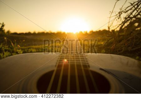 Guitar During The Sunset.playing Guitar With Some Friends During The Golden Hour In The Nature,just 