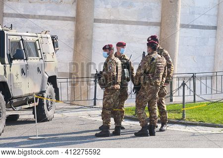 Pisa, Italy - March 10, 2021 - Italian Soldiers Wearing Surgical Masks Guard The Entrance To The Lea
