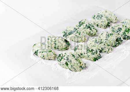 Cooking Gnudi With Ricotta And Spinach On White Board. Italian Meal