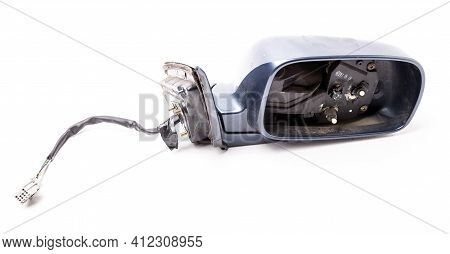Close-up On A Side Mirror From A Sedan For Repair And Replacement After An Accident In A Workshop. A