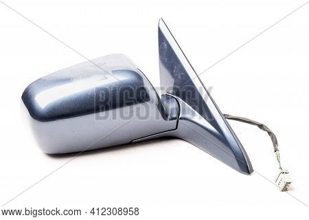 Close-up On A Side Mirror From A Sedan For Repair And Replacement After An Accident In A Workshop. A