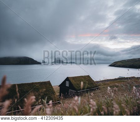 Bour Village Grass-covered Picturesque Houses At The Faroese Coastline In The Village Bour With View