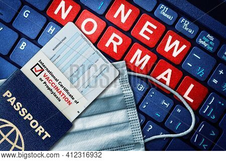 Passport, Boarding Pass And Certificate Of Covid-19 Vaccination On Keyboard With Face Mask. Vaccine 