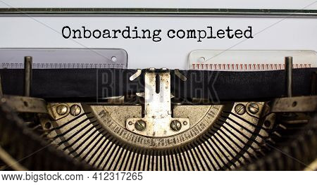 Onboarding Completed Symbol. Words Onboarding Completed Typed On Retro Typewriter. Business And Onbo