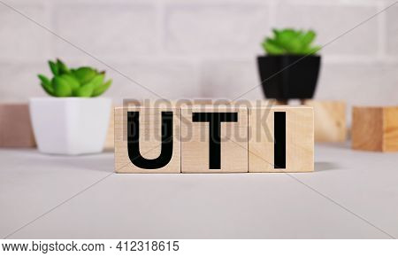 Uti .urinary Tract Infection. Text On Wood Cubes. Text In Black Letters On Wood Blocks
