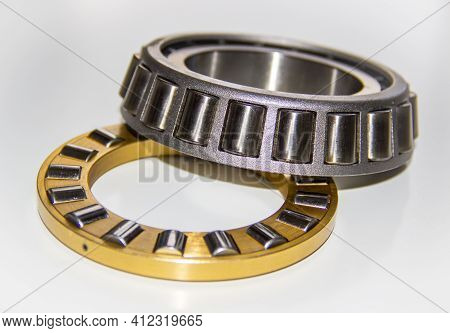 Brass Roller Cage Of A Thrust Roller Bearing And Stainless Roller Cage Of A Tapered Roller Bearing W
