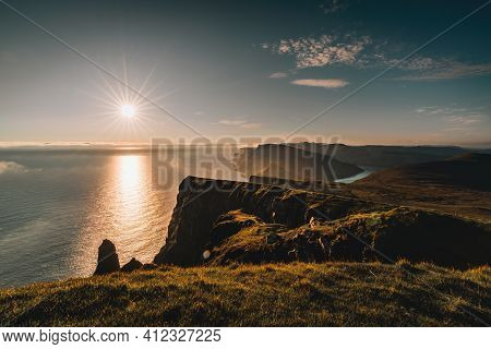 Aerial Drone Panorama View On Faroe Islands Suduroy Todwards Beinisvord During Sunset.
