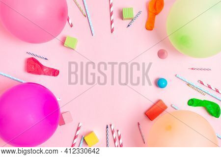Colorful Balloons And Confetti On Blue Table Top View. Festive Or Party Background. Flat Lay Style. 