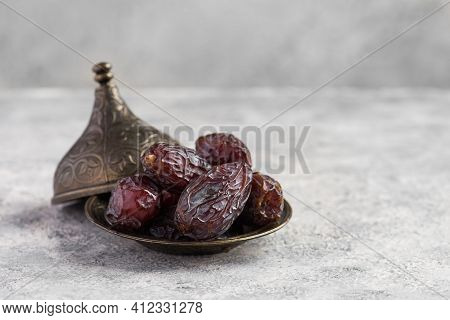 Hurma, Dates. Dried Dates Fruit With Wooden Plate On White Background. Popular Fruit Of Ramadan.
