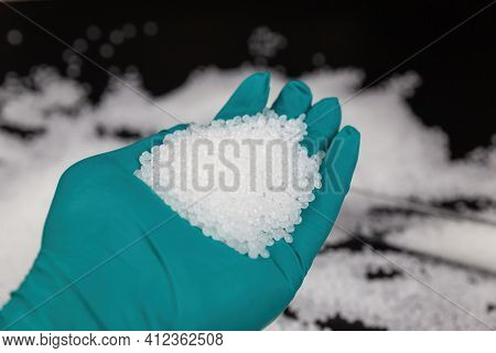White Plastic Beads On Black Background, Polymers Bead Or Polymer Resin, Polymer Pallet, Product Fro
