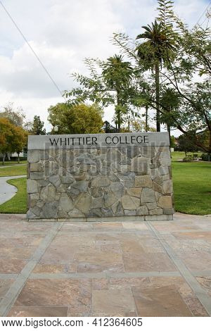 March 12, 2021 - Whittier, California: Whittier College. Large Rock Wall with WHITTIER COLLEGE Sign at the entrance to campus. Closed due to Coronavirus Pandemic. Editorial Use Only. 