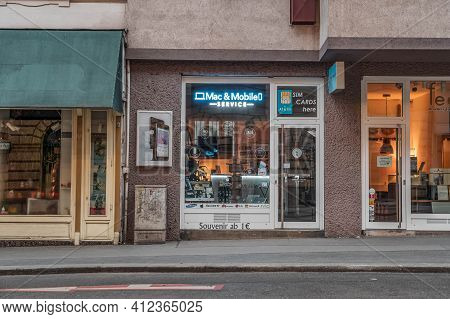 Vienna, Austria - Feb 7, 2020: Mac Mobile Repair Store In Josefstadt Street In City Center In Winter