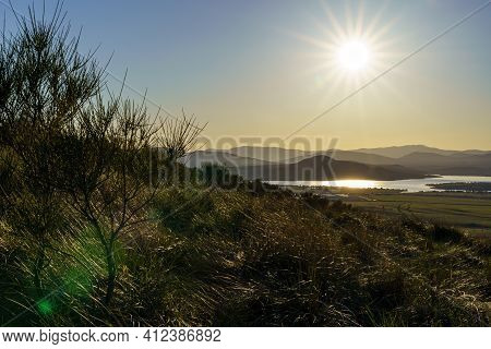 Sunset In The Mountains With Water Lake In The Valley And Sun Rays In The Blue Sky. Navacerrada Madr