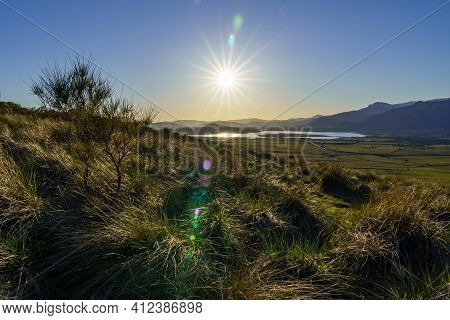 Sunset In The Mountains With Water Lake In The Valley And Sun Rays In The Blue Sky. Navacerrada Madr