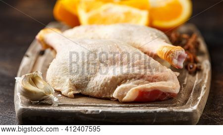 Raw Fresh Free Range Duck Legs On Wooden Board With Ready To Cook