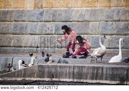 Prague, Czech Republic - March 12. People Wearing Face Mask Protection On Public Places In Riverbank
