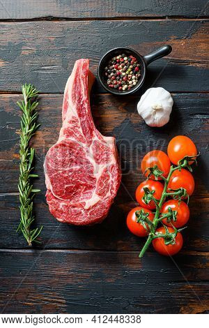 Raw Uncooked Black Angus Beefmarket Steak Closeup With Tomatoes Garlic Herbs And Peppercorns Rosemar