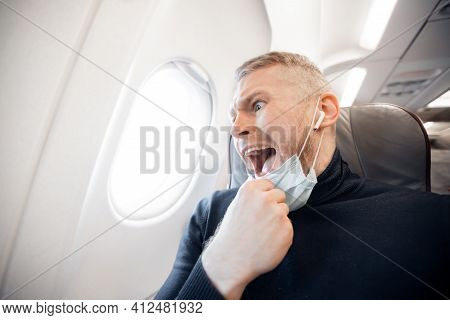 Concept Aerophobia Or Aviophobia. Afraid Of Fear Flying On Airplane And Height Tourist Man In Safe M