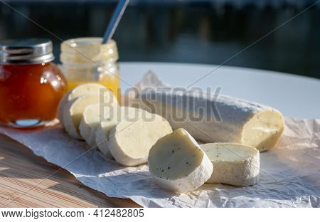 Belgian Abbey Cheese Fagotin In Pieces With Jam Served Outdoor With View On Maas River And Center Of