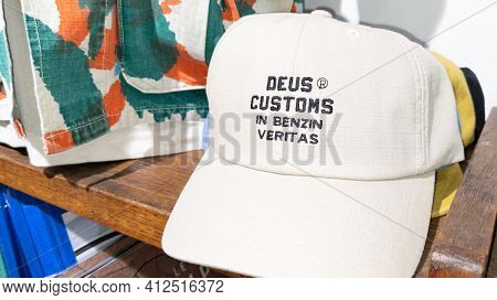 Bordeaux , Aquitaine France - 03 08 2021 : Deus Customs In Benzin Veritas Cap In The Store With Text