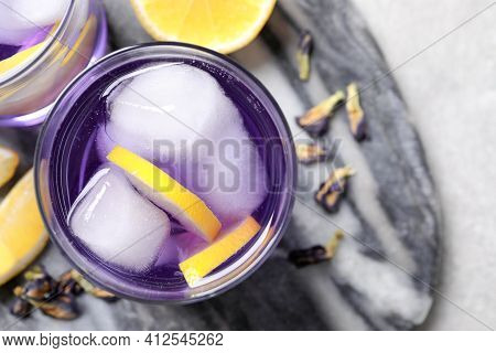 Organic Blue Anchan And Lemon On Light Grey Table, Top View With Space For Text. Herbal Tea