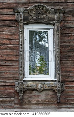 Tomsk, Window Of An Old Wooden Residential Building In A Traditional Style