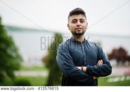 Сonfident Pakistani Indian Muslim Arabic Boy In Grey Kameez Shalwar Suit.