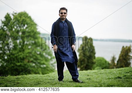 Stylish Pakistani Indian Muslim Arabic Man In Kurta Dhoti Suit And Sunglasses.
