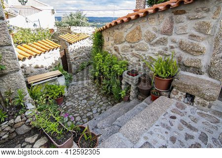 Belmonte, Portugal; May 2017 : Traditional House Full Of Plants And Flowers In Belmonte, Portugal