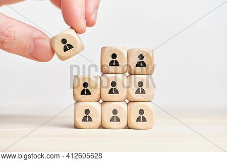 Teambuilding And Teamwork Concept On Wooden Cubes With Abstract Personas Employee.