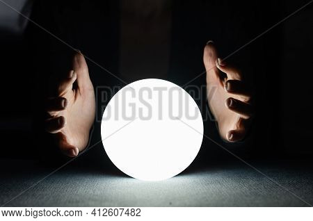 A Fortune Teller Gazes Into Her Ball