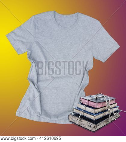 Gray Tshirt Mockup With Stack Of Book Casual Fashion Clothing On A Yellow And Purple Background With