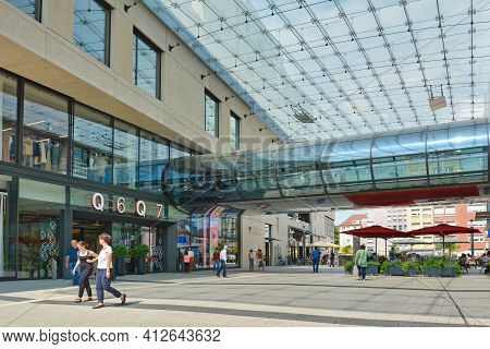 Mannheim, Germany - July 2019: Entrance Of Big Modern Shopping Center Called 'q6 Q7' With People In 