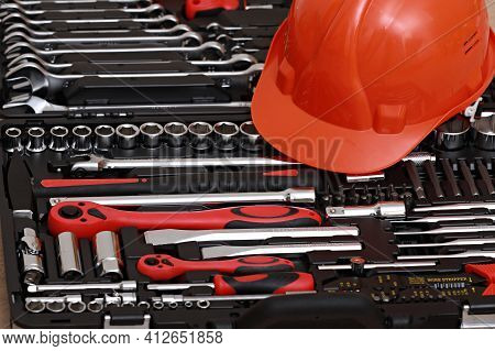 Toolbox, Tools Kit Detail And Orange Protective Helmet Close Up. Instruments. Set Of Tools. Car Tool