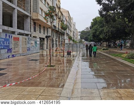 Málaga, Spain - February 21, 2021: View Of Streets Of Soho Málaga In A Rainy Day