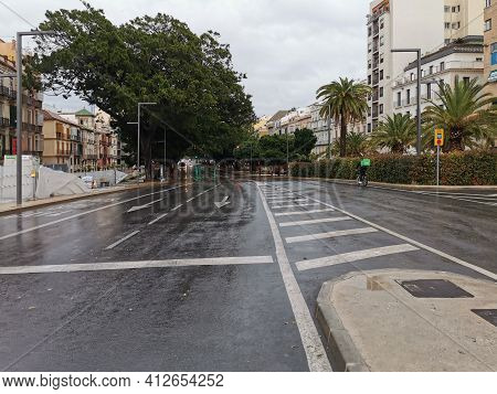 Málaga, Spain - February 21, 2021: View Of The Streets And Buildings Of Soho In Málaga Ia Rainy Day.