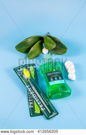 Moscow, Russia - 9 Matra 2021: Mouthwash, Toothbrush On A Blue Background.the Concept Of Proper Oral