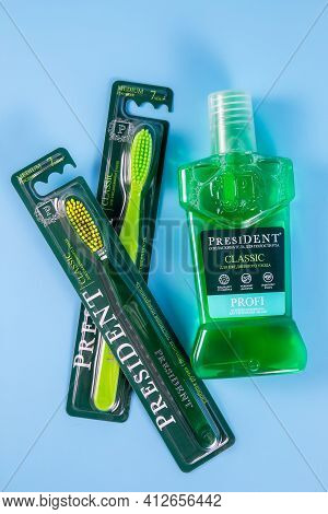 Moscow, Russia - 9 Matra 2021: Mouthwash, Toothbrush On A Blue Background.the Concept Of Proper Oral