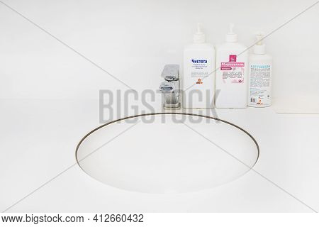Moscow, Russia - 9th Matra 2021: White Sink Built Into White Countertop And Hand Sanitizer And Tools