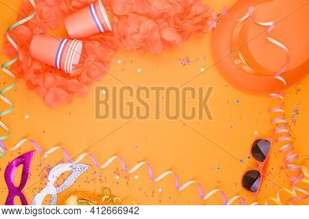 Decor For A Traditional Celebration Of Kings Day In The Netherlands. Orange Hat, Glasses, Jewelry An