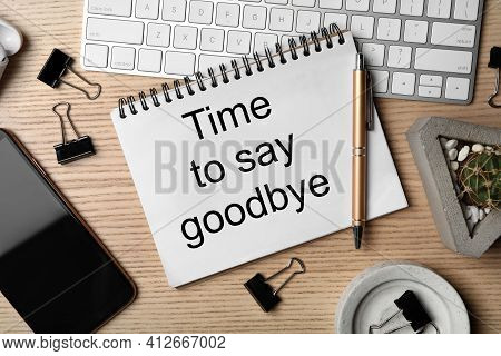 Notebook With Text Time To Say Goodbye, Keyboard And Smartphone On Wooden Table, Flat Lay