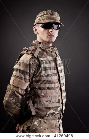 Military Man On A Black Background