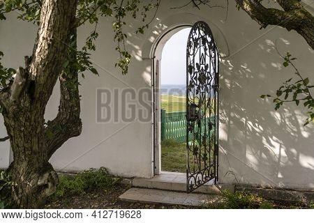 Spaso-preobrazhensky Monastery Posolskoye At Great Baykal Lake In Russia With Garden And Iron Garden