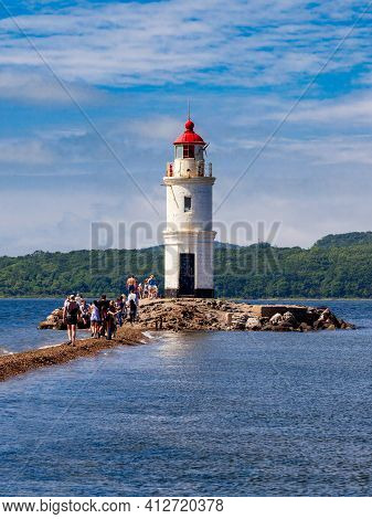 Lighthouse Tokarevskiy Egersheld On Tokarevskaya Koshka Cape In Vladivostok, Primorsky Krai In Russi