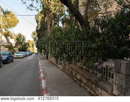 Jerusalem, Israel, February 27, 2021 : Evening View Of The Quiet, Green Hovevei Tsiyon Street In The