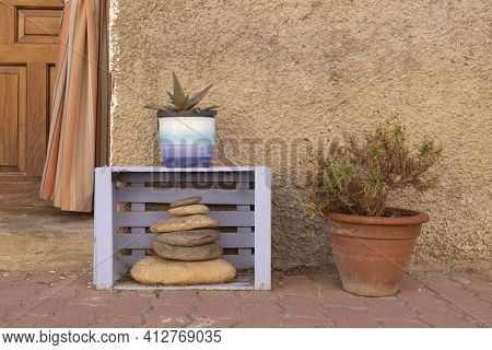 A Funny Charming Home Corner In The Small Town Of Ambel, Made Up Of An Old Wooden Box, Painted Purpl
