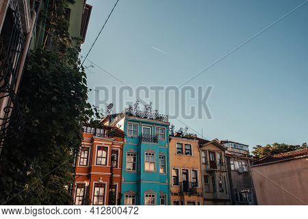 Blue, Cloudless Sky Above Colorful Houses With Green Ivy In Balat, Istanbul, Turkey.