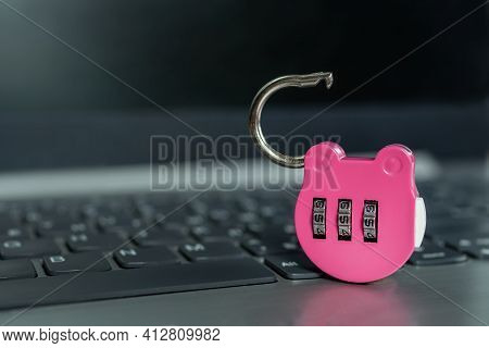 Pink Combination Lock On A Laptop. Selected Focus. Open