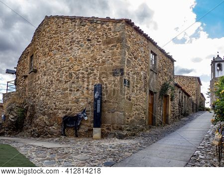 Castelo Rodrigo, Portugal - August  2020: View Of The Cobble Street Leading To The Clock Tower And T